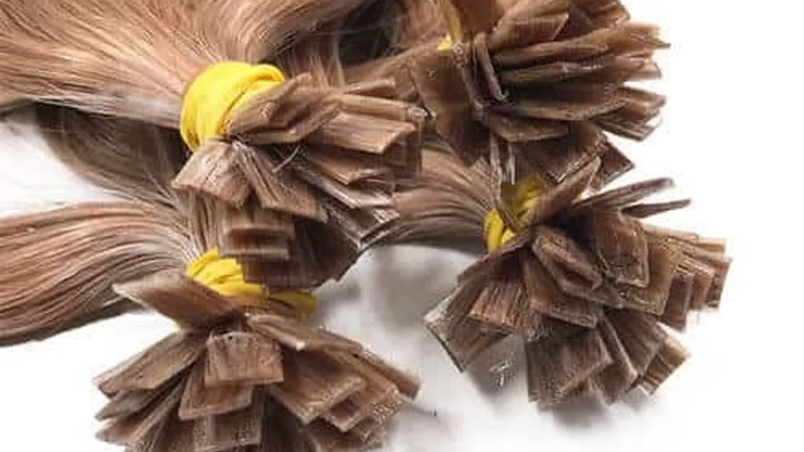 Salon buyer QC layout of wholesale flat tip hair extensions with flat rectangular keratin bonds on Remy human hair bundles